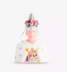 a small figurine of a man wearing a crown
